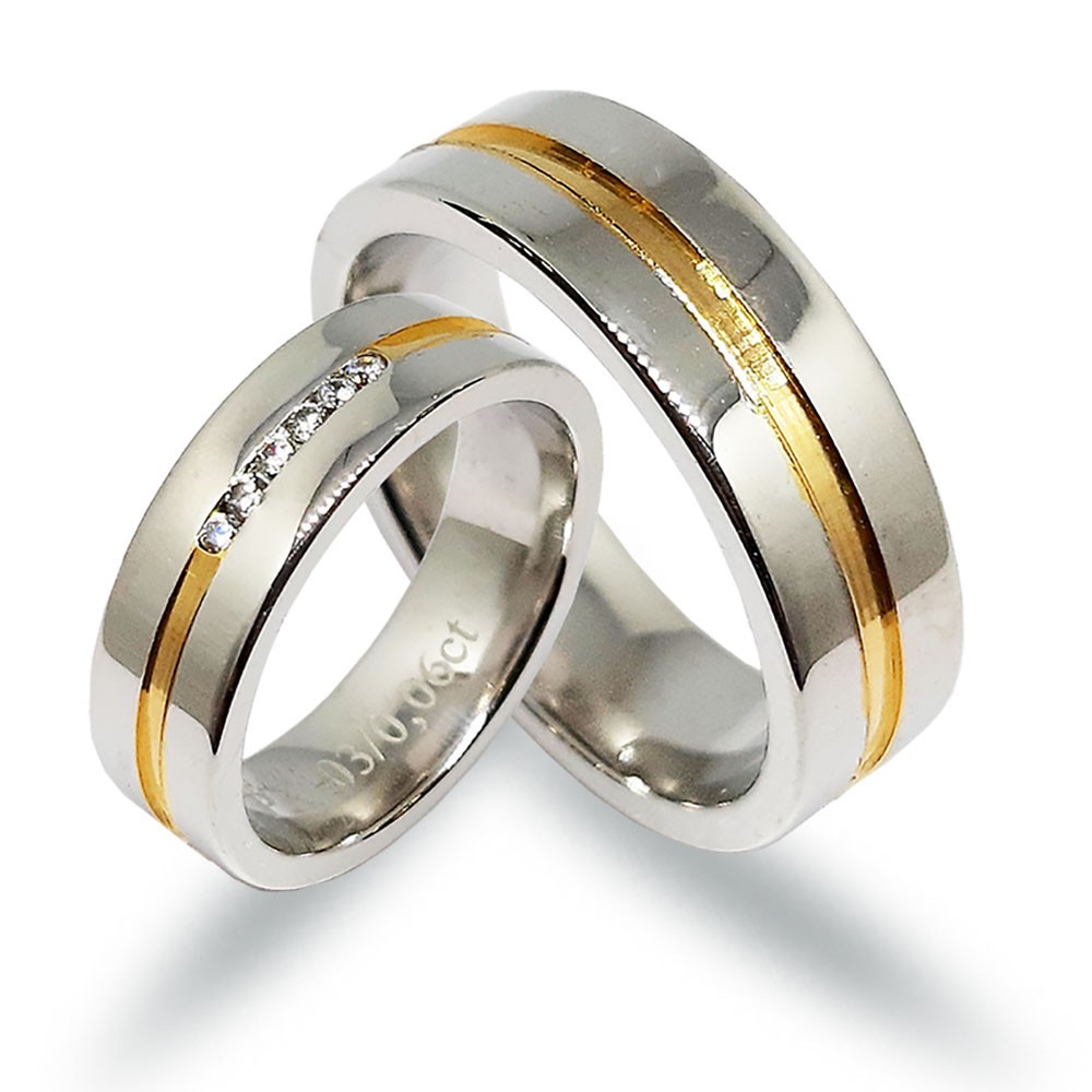 Ein paar Trauringe, Weiß- und Gelbgold 585, mit 0,06 ct Diamanten (PK0)